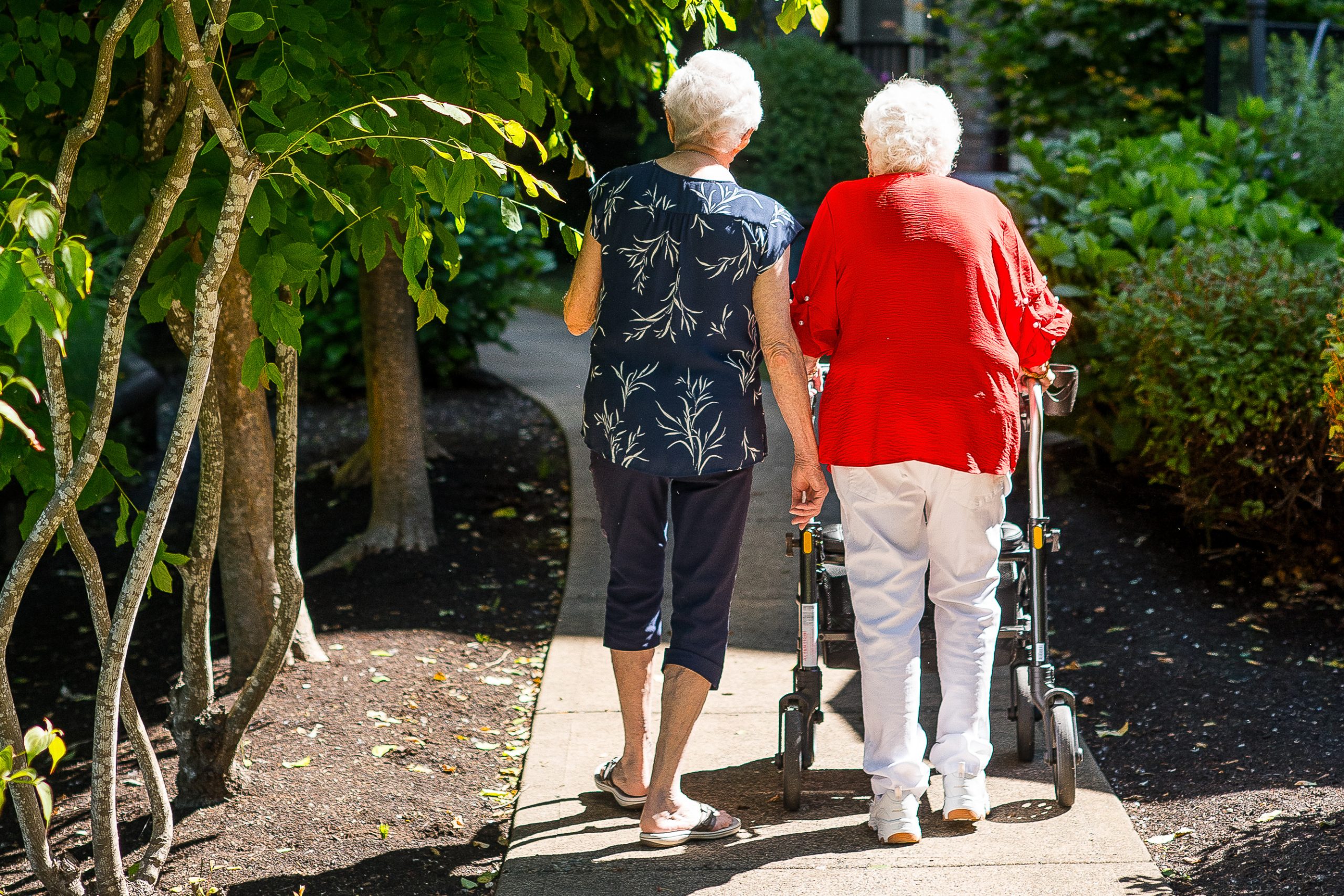 sun village senior woman walking outside